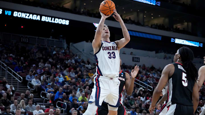 Mar 20, 2025; Wichita, KS, USA; Gonzaga Bulldogs forward Ben Gregg (33) shoots against Georgia Bulldogs guard Silas Demary Jr. (5) in the second half of a first round men’s NCAA Tournament game at Intrust Bank Arena. Mandatory Credit: Kirby Lee-Imagn Images