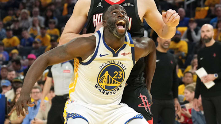 Apr 26, 2025; San Francisco, California, USA; Golden State Warriors forward Draymond Green (23) blocks out Houston Rockets center Alperen Sengun (back) during the fourth quarter of game three of first round for the 2024 NBA Playoffs at Chase Center. Mandatory Credit: Darren Yamashita-Imagn Images