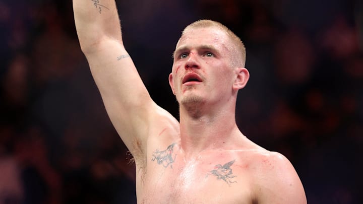Apr 26, 2025; Kansas City, Missouri, UNITED STATES; Ian Machado Garry (red gloves) reacts after defeating Carlos Prates (not pictured) during UFC Fight Night at T-Mobile Center. Mandatory Credit: William Purnell-Imagn Images