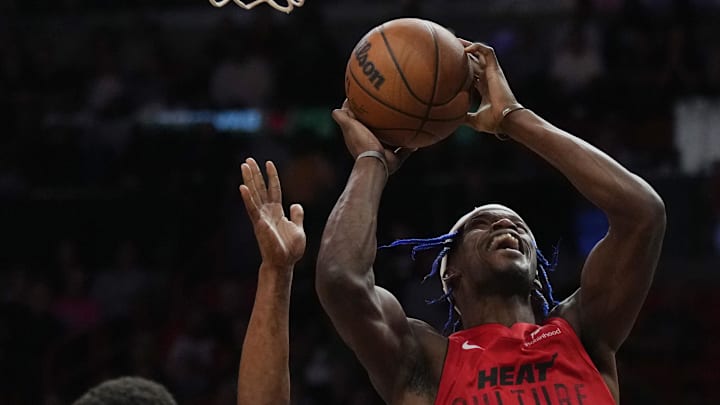 Dec 7, 2024; Miami, Florida, USA; Miami Heat forward Jimmy Butler (22) shoots the ball against Phoenix Suns guard Devin Booker (1) during the second half at Kaseya Center. Mandatory Credit: Jim Rassol-Imagn Images Dec 7, 2024; Miami, Florida, USA; Miami Heat forward Jimmy Butler (22) shoots the ball against Phoenix Suns guard Devin Booker (1) during the second half at Kaseya Center. Mandatory Credit: Jim Rassol-Imagn Images