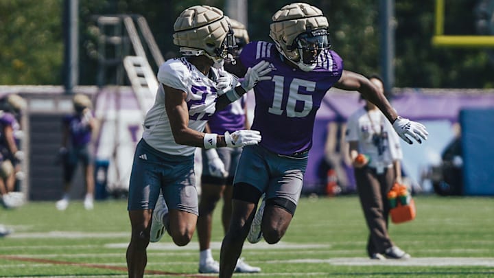 Justice Williams (16) tries to get free from coverage in spring ball. 