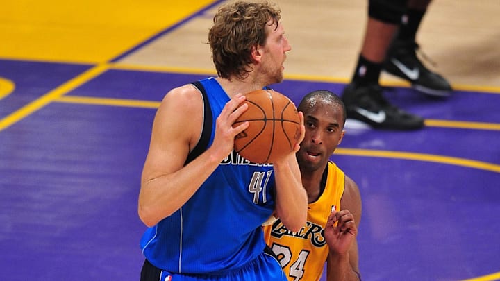 May 4, 2011; Los Angeles, CA, USA; Dallas Mavericks  power forward Dirk Nowitzki (41) controls the ball against the defense of Los Angeles Lakers shooting guard Kobe Bryant (24) during the second half in game two of the second round of the 2011 NBA playoffs at the Staples Center. Mandatory Credit: Gary A. Vasquez-Imagn Images
