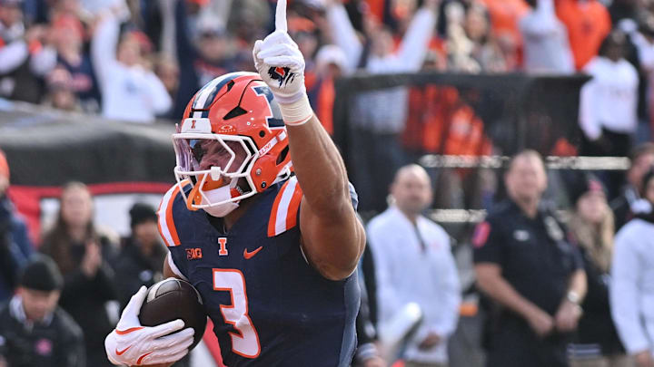 Nov 1, 2025; Champaign, Illinois, USA;  Illinois Fighting Illini running back Kaden Feagin (3) scores a touchdown during the first half against the Rutgers Scarlet Knights at Memorial Stadium. Mandatory Credit: Ron Johnson-Imagn Images