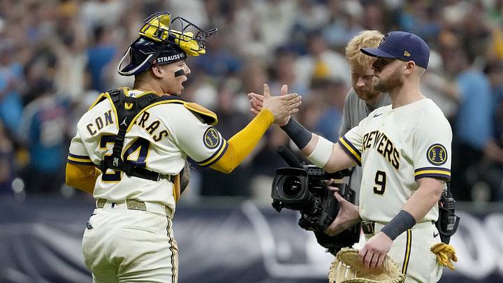 Milwaukee Brewers catcher William Contreras (24) and Milwaukee Brewers first baseman Jake Bauers (9) celebrate a 7-4 win of their National League Championship Series game against the Los Angeles Dodgers at American Family Field on Oct 12, 2026. Milwaukee Brewers catcher William Contreras (24) and Milwaukee Brewers first baseman Jake Bauers (9) celebrate a 7-4 win of their National League Championship Series game against the Los Angeles Dodgers at American Family Field on Oct 12, 2026.