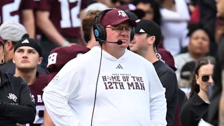 Dec 20, 2025; College Station, TX, USA; Texas A&M Aggies head coach Mike Elko reacts during the first quarter during the first round of the CFP National Playoff against the Miami Hurricanes at Kyle Field. Mandatory Credit: Maria Lysaker-Imagn Images