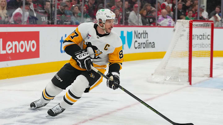 Mar 18, 2026; Raleigh, North Carolina, USA;  Pittsburgh Penguins center Sidney Crosby (87) skates with the puck against the Carolina Hurricanes during the first period at Lenovo Center. Mandatory Credit: James Guillory-Imagn Images