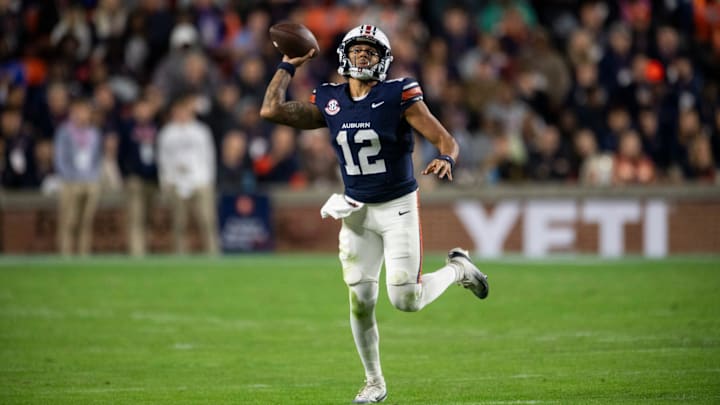 Auburn Tigers quarterback Ashton Daniels (12) pump fakes a pass as Auburn Tigers take on Kentucky Wildcats at Jordan-Hare Stadium in Auburn, Ala. on Saturday, Nov. 1, 2025. Auburn Tigers and Kentucky Wildcats are tied 3-3 at halftime.