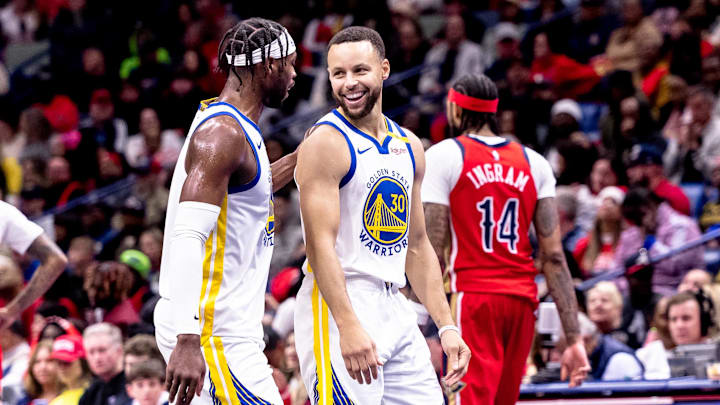 Nov 22, 2024; New Orleans, Louisiana, USA;  Golden State Warriors guard Stephen Curry (30) shares a moment with guard Buddy Hield (7) on a time out against the New Orleans Pelicans during second half at Smoothie King Center. Mandatory Credit: Stephen Lew-Imagn Images