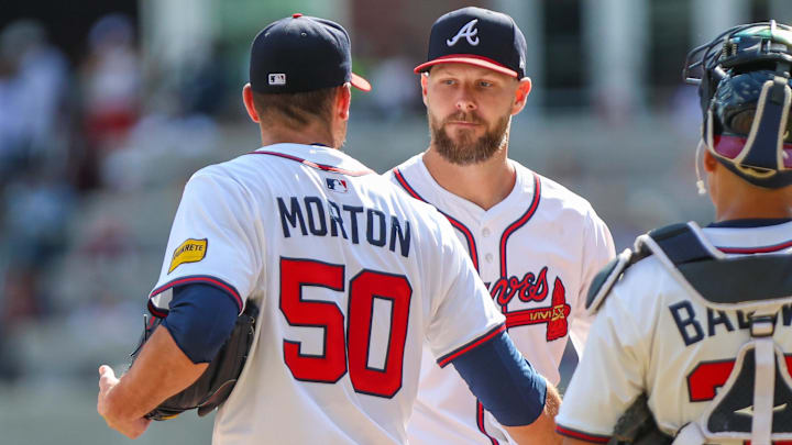 Sep 28, 2025; Cumberland, Georgia, USA; Atlanta Braves pitcher Charlie Morton (50) shakes hands with teammate pitcher Chris Sale (51) after pitching against the Pittsburgh Pirates during the second inning at Truist Park. Mandatory Credit: Jordan Godfree-Imagn Images Sep 28, 2025; Cumberland, Georgia, USA; Atlanta Braves pitcher Charlie Morton (50) shakes hands with teammate pitcher Chris Sale (51) after pitching against the Pittsburgh Pirates during the second inning at Truist Park. Mandatory Credit: Jordan Godfree-Imagn Images