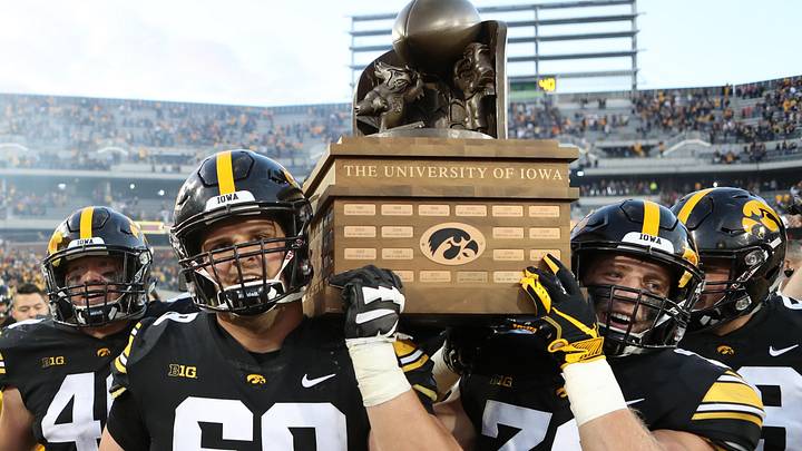 Sep 8, 2018; Iowa City, IA, USA; Iowa Hawkeyes offensive lineman Keegan Render (69) and Iowa Hawkeyes defensive back Jake Gervase (30) carry the Cy-Hawk trophy off the field after defeating the Iowa State Cyclones at Kinnick Stadium. The Hawkeyes beat the Cyclones 13 to 3. Mandatory Credit: Reese Strickland-Imagn Images Sep 8, 2018; Iowa City, IA, USA; Iowa Hawkeyes offensive lineman Keegan Render (69) and Iowa Hawkeyes defensive back Jake Gervase (30) carry the Cy-Hawk trophy off the field after defeating the Iowa State Cyclones at Kinnick Stadium. The Hawkeyes beat the Cyclones 13 to 3. Mandatory Credit: Reese Strickland-Imagn Images