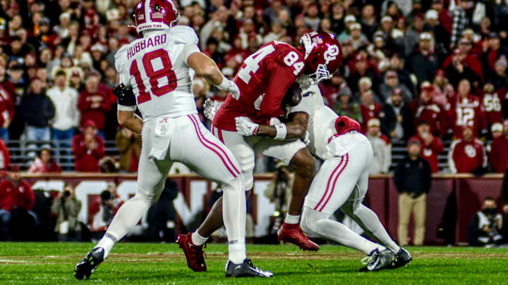 Oklahoma wide receiver Jer'Michael Carter catches a pass against Alabama in the CFP.