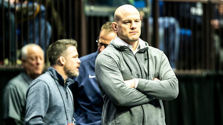 Penn State wrestling coach Cael Sanderson watches during the third session of the NCAA Division I Wrestling Championships.