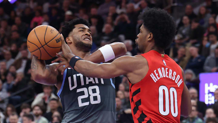Feb 12, 2026; Salt Lake City, Utah, USA; Utah Jazz forward Brice Sensabaugh (28) drives against Portland Trail Blazers guard Scoot Henderson (00) during the second half at Delta Center. Mandatory Credit: Rob Gray-Imagn Images