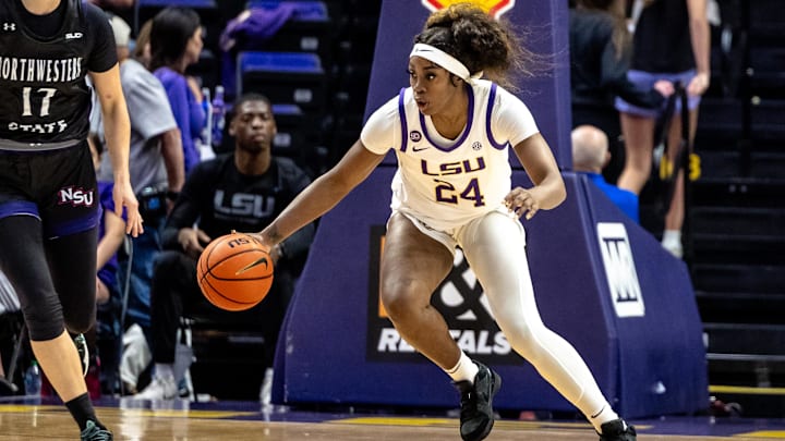 Nov 8, 2024; Baton Rouge, Louisiana, USA; LSU Lady Tigers guard Aneesah Morrow (24) dribbles against Northwestern State Lady Demons guard Carla Celaya (17) during the first half at Pete Maravich Assembly Center. Mandatory Credit: Stephen Lew-Imagn Images Nov 8, 2024; Baton Rouge, Louisiana, USA; LSU Lady Tigers guard Aneesah Morrow (24) dribbles against Northwestern State Lady Demons guard Carla Celaya (17) during the first half at Pete Maravich Assembly Center. Mandatory Credit: Stephen Lew-Imagn Images