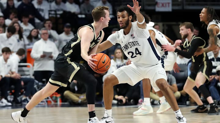 Penn State Nittany Lions forward Zach Hicks (24) defends Purdue Boilermakers guard Fletcher Loyer (2) 