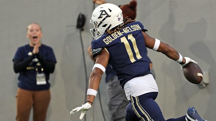 Akron Zips cornerback Devonte Golden-Nelson celebrates in the end zone after a first-half pick six against Morgan State, Saturday, Sept. 9, 2023.