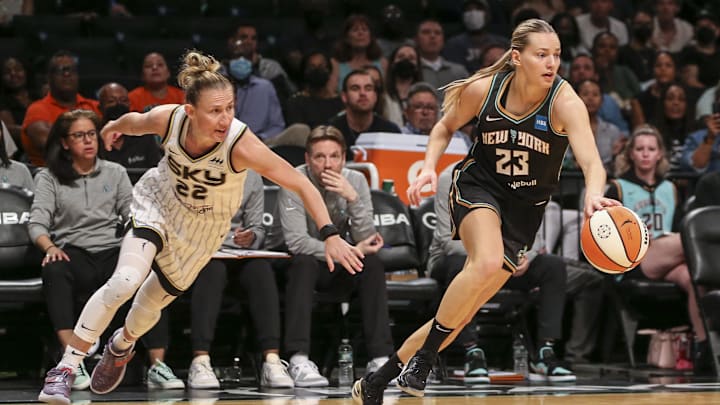 Aug 23, 2022; Brooklyn, New York, USA; New York Liberty guard Marine Johannes (23) steals the ball from Chicago Sky guard Courtney Vandersloot (22) in the third quarter at Barclays Center. Mandatory Credit: Wendell Cruz-Imagn Images