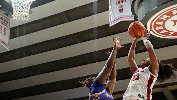 Nov. 10, 2025; Tuscaloosa, Alabama, USA; Alabama guard Jessica Timmons (23) shoots in the lane with Alcorn center Chrishunti Walker (25) defending at Coleman Coliseum.