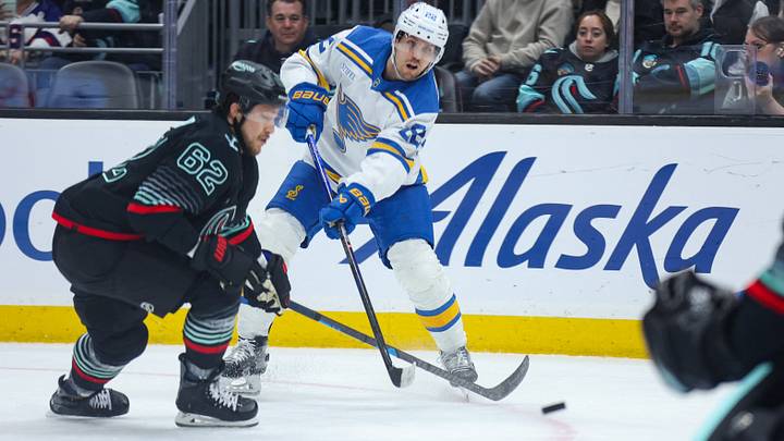Mar 4, 2026; Seattle, Washington, USA; St. Louis Blues center Pius Suter (22) attempts a shot on goal in the first period against the Seattle Kraken at Climate Pledge Arena. Mandatory Credit: Kevin Ng-Imagn Images Mar 4, 2026; Seattle, Washington, USA; St. Louis Blues center Pius Suter (22) attempts a shot on goal in the first period against the Seattle Kraken at Climate Pledge Arena. Mandatory Credit: Kevin Ng-Imagn Images
