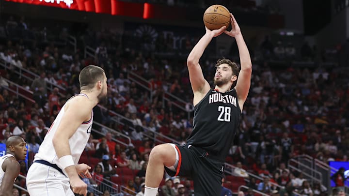 Nov 15, 2024; Houston, Texas, USA; Houston Rockets center Alperen Sengun (28) shoots the ball as Los Angeles Clippers center Ivica Zubac (40) defends during the third quarter at Toyota Center. Mandatory Credit: Troy Taormina-Imagn Images