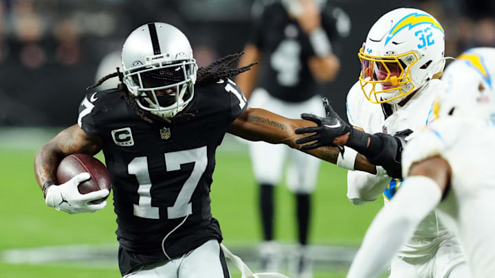 Dec 14, 2023; Paradise, Nevada, USA; Las Vegas Raiders wide receiver Davante Adams (17) runs against Los Angeles Chargers safety Alohi Gilman (32) in the first quarter at Allegiant Stadium. Mandatory Credit: Stephen R. Sylvanie-USA TODAY Sports