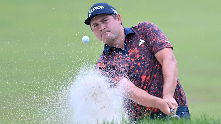Jun 11, 2023; Toronto, ON, CAN;  Andrew Novak plays a bunker shot on the 17th hole during the final