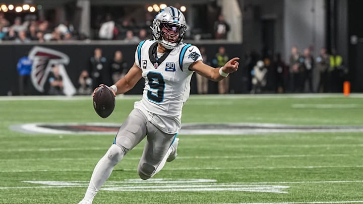 Jan 5, 2025; Atlanta, Georgia, USA; Carolina Panthers quarterback Bryce Young (9) runs for a touchdown against the Atlanta Falcons during the second half at Mercedes-Benz Stadium.