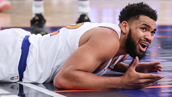 Jan 21, 2026; New York, New York, USA;  New York Knicks center Karl-Anthony Towns (32) reacts after getting called for an offensive foul in the second quarter against the Brooklyn Nets at Madison Square Garden.