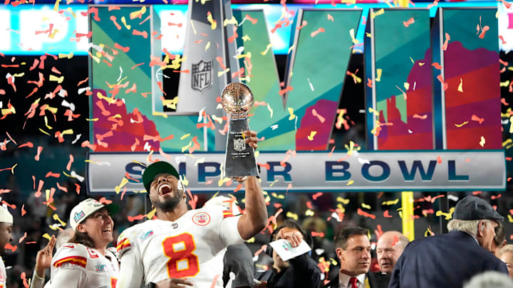 Kansas City Chiefs defensive end Carlos Dunlap (8) celebrates with the Lombardi Trophy after defeating the Philadelphia Eagles in Super Bowl LVII at State Farm Stadium in Glendale on Feb. 12, 2023.