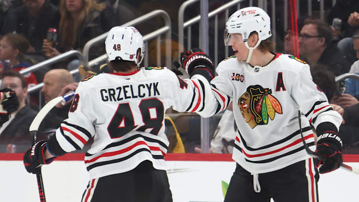 Jan 29, 2026; Pittsburgh, Pennsylvania, USA;  Chicago Blackhawks defenseman Matt Grzelcyk (48) congratulates defenseman Connor Murphy (right) on his goal against the Pittsburgh Penguins during the first period at PPG Paints Arena. Mandatory Credit: Charles LeClaire-Imagn Images