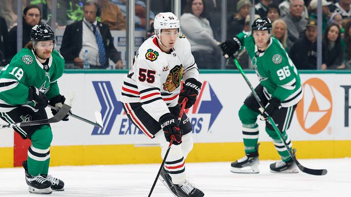 Dec 27, 2025; Dallas, Texas, USA; Chicago Blackhawks defenseman Artyom Levshunov (55) skates with the puck between Dallas Stars center Sam Steel (18) and right wing Mikko Rantanen (96) during the first period at American Airlines Center. Mandatory Credit: Chris Jones-Imagn Images