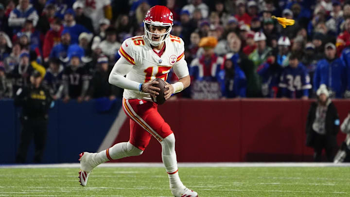 Nov 17, 2024; Orchard Park, New York, USA; Kansas City Chiefs quarterback Patrick Mahomes (15) rolls out looking to throw the ball against the Buffalo Bills during the second half at Highmark Stadium. Mandatory Credit: Gregory Fisher-Imagn Images