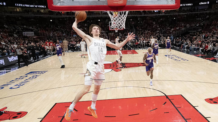 Feb 22, 2025; Chicago, Illinois, USA; Chicago Bulls forward Matas Buzelis (14) goes up for a dunk against the Phoenix Suns during the first half at United Center. Mandatory Credit: David Banks-Imagn Images