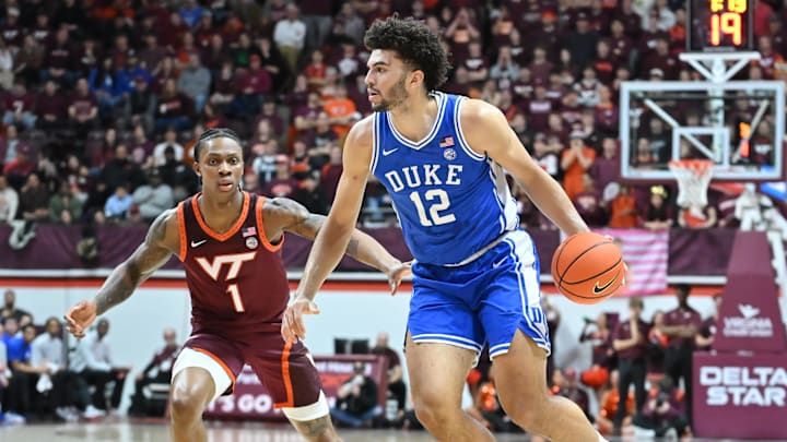 Jan 31, 2026; Blacksburg, Virginia, USA; Duke basketball forward Cameron Boozer (12) controls the ball as Virginia Tech Hokies forward Tobi Lawal (1) defends during the first half at Cassell Coliseum. Jan 31, 2026; Blacksburg, Virginia, USA; Duke basketball forward Cameron Boozer (12) controls the ball as Virginia Tech Hokies forward Tobi Lawal (1) defends during the first half at Cassell Coliseum.