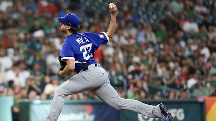 Mar 11, 2026; Houston, TX, United States; Italy starting pitcher Aaron Nola (27) pitches against Mexico in the first inning  at Daikin Park. Mandatory Credit: Thomas Shea-Imagn Images