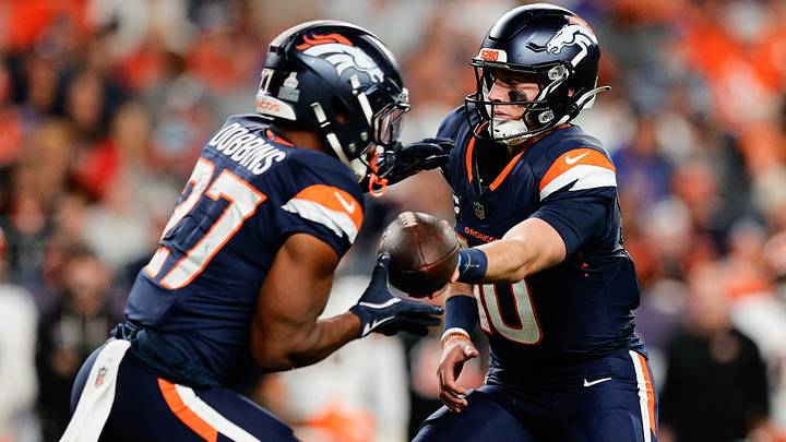 Sep 29, 2025; Denver, Colorado, USA; Denver Broncos quarterback Bo Nix (10) hands the ball off to Denver Broncos running back J.K. Dobbins (27) during the third quarter against the Cincinnati Bengals at Empower Field at Mile High. Sep 29, 2025; Denver, Colorado, USA; Denver Broncos quarterback Bo Nix (10) hands the ball off to Denver Broncos running back J.K. Dobbins (27) during the third quarter against the Cincinnati Bengals at Empower Field at Mile High.