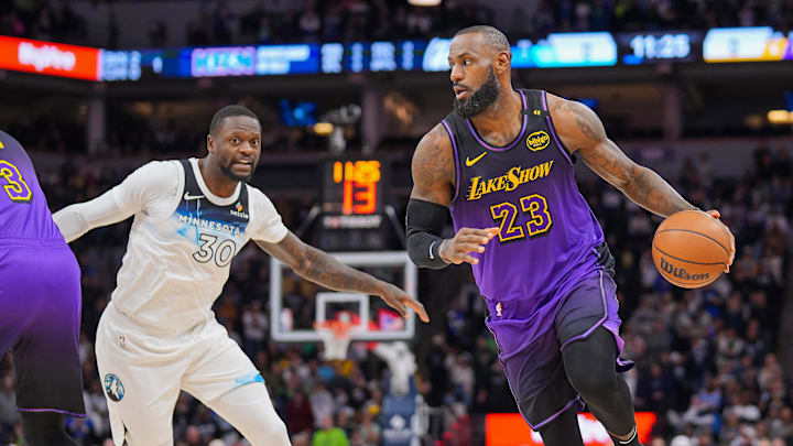 Dec 2, 2024; Minneapolis, Minnesota, USA; Los Angeles Lakers forward LeBron James (23) dribbles against the Minnesota Timberwolves in the first quarter at Target Center.