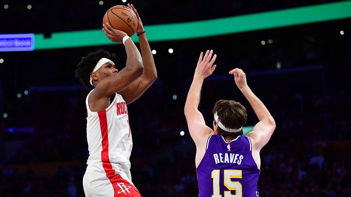 Houston Rockets guard Amen Thompson shoots against Los Angeles Lakers guard Austin Reaves.