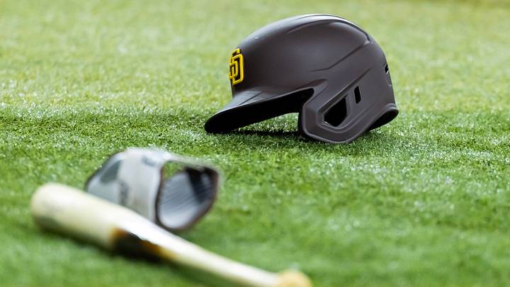 Jun 13, 2025; Phoenix, Arizona, USA; Detailed view of a San Diego Padres batting helmet and baseball bat on the field at Chase Field. Mandatory Credit: Mark J. Rebilas-Imagn Images Jun 13, 2025; Phoenix, Arizona, USA; Detailed view of a San Diego Padres batting helmet and baseball bat on the field at Chase Field. Mandatory Credit: Mark J. Rebilas-Imagn Images