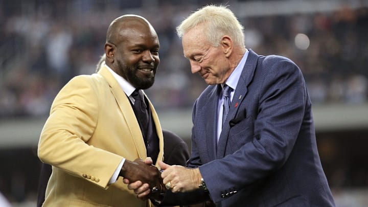 Nov 21, 2010; Arlington, TX, USA; Dallas Cowboys former running back Emmitt Smith (left) shakes owner Jerry Jones hand after being presented his hall of fame ring at halftime of the game against the Detroit Lions at Cowboys Stadium. Mandatory Credit: Matthew Emmons- Imagn Images