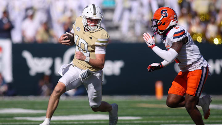 Oct 25, 2025; Atlanta, Georgia, USA; Georgia Tech Yellow Jackets quarterback Haynes King (10) runs the ball against the Syracuse Orange in the fourth quarter at Bobby Dodd Stadium at Hyundai Field. Mandatory Credit: Brett Davis-Imagn Images