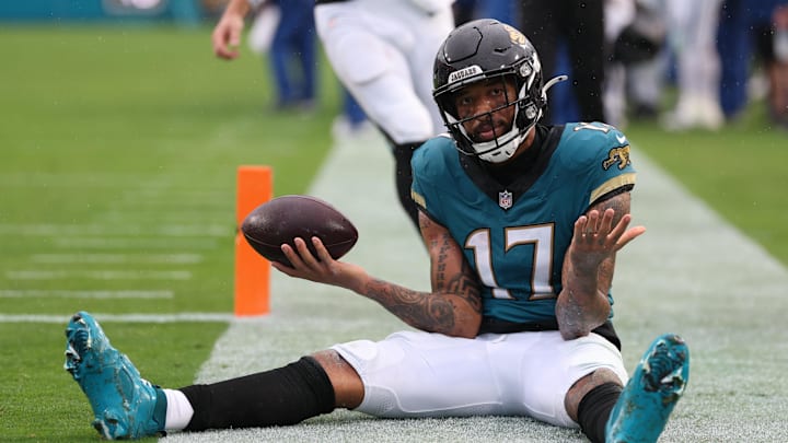 Dec 7, 2025; Jacksonville, Florida, USA;  Jacksonville Jaguars wide receiver Tim Patrick (17) sits on the field after catching a touchdown pass against the Indianapolis Colts during the first half at EverBank Stadium. Mandatory Credit: Matt Pendleton-Imagn Images