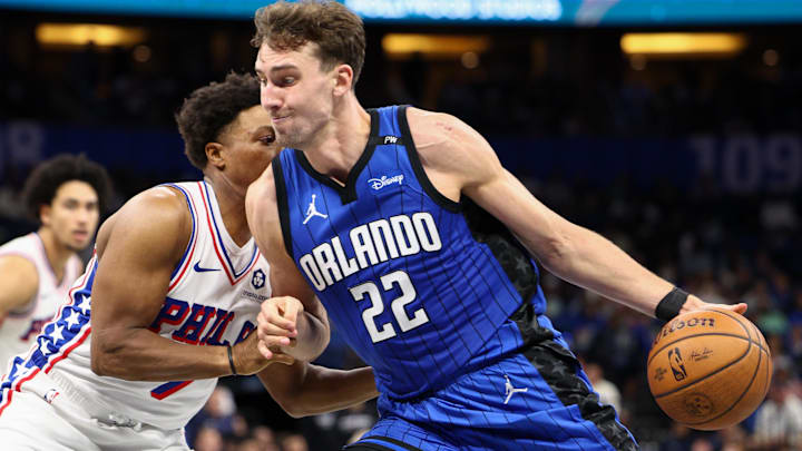 Nov 15, 2024; Orlando, Florida, USA; Orlando Magic forward Franz Wagner (22) is guarded by Philadelphia 76ers guard Kyle Lowry (7) in the third quarter at Kia Center. Mandatory Credit: Nathan Ray Seebeck-Imagn Images