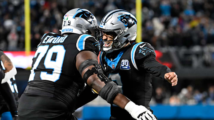 Dec 1, 2024; Charlotte, North Carolina, USA; Carolina Panthers quarterback Bryce Young (9) celebrates with offensive tackle Ikem Ekwonu (79) after the panthers score with 30 seconds left to take the lead in the fourth quarter at Bank of America Stadium. Mandatory Credit: Bob Donnan-Imagn Images