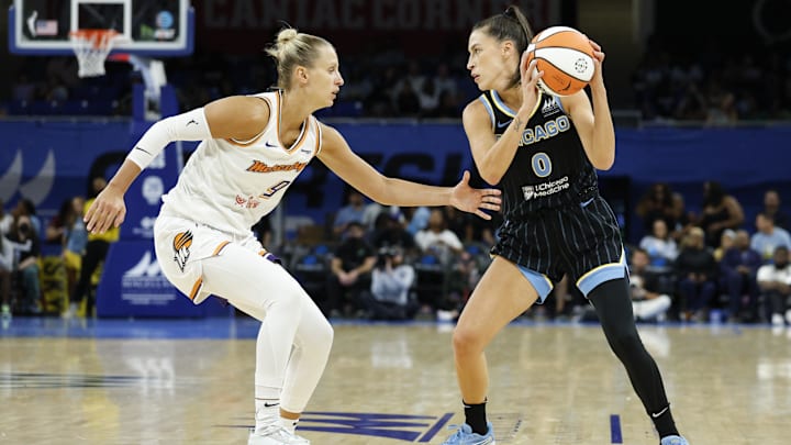 Aug 3, 2025; Chicago, Illinois, USA; Chicago Sky guard Sevgi Uzun (0) looks to pass the ball against Phoenix Mercury guard Kitija Laksa (9) during the second half at Wintrust Arena. Mandatory Credit: Kamil Krzaczynski-Imagn Images