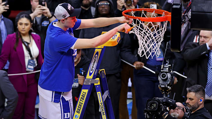 Mar 29, 2025; Newark, NJ, USA; Duke Blue Devils forward Cooper Flagg (2) cuts down the net after the Duke Blue Devils beat the Alabama Crimson Tide in the East Regional final of the 2025 NCAA tournament at Prudential Center. Mandatory Credit: Vincent Carchietta-Imagn Images