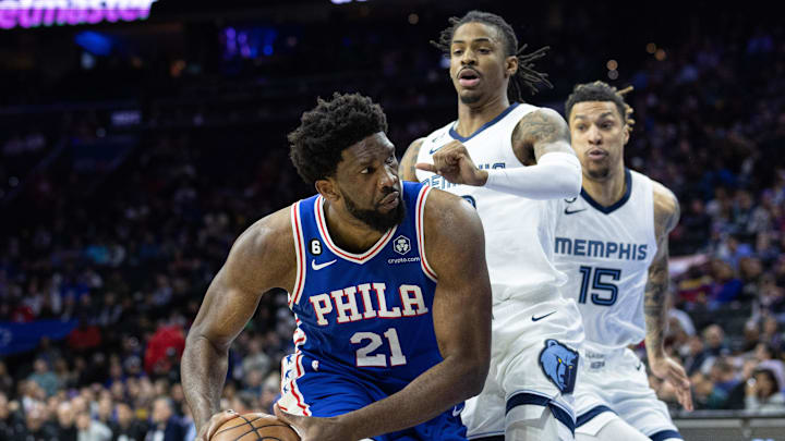 Philadelphia 76ers center Joel Embiid (21) drives against Memphis Grizzlies guard Ja Morant (12) during the first quarter at Wells Fargo Center. Mandatory Credit: Bill Streicher-Imagn Images Philadelphia 76ers center Joel Embiid (21) drives against Memphis Grizzlies guard Ja Morant (12) during the first quarter at Wells Fargo Center. Mandatory Credit: Bill Streicher-Imagn Images