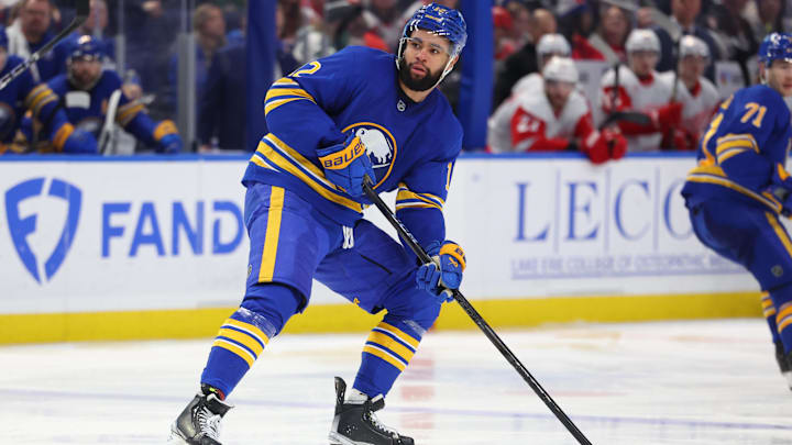 Dec 9, 2024; Buffalo, New York, USA;  Buffalo Sabres left wing Jordan Greenway (12) looks for the puck during the third period against the Detroit Red Wings at KeyBank Center. Mandatory Credit: Timothy T. Ludwig-Imagn Images