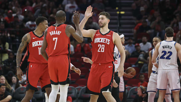 Nov 16, 2025; Houston, Texas, USA; Houston Rockets center Alperen Sengun (28) and forward Kevin Durant (7) celebrate after a play during the second quarter against the Orlando Magic at Toyota Center. Mandatory Credit: Troy Taormina-Imagn Images