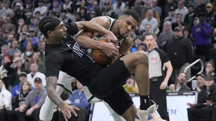 Jan 2, 2025; Milwaukee, Wisconsin, USA; Milwaukee Bucks forward Giannis Antetokounmpo (34) and Brooklyn Nets guard Keon Johnson (45) battle for a rebound in the second half at Fiserv Forum. Mandatory Credit: Michael McLoone-Imagn Images Jan 2, 2025; Milwaukee, Wisconsin, USA; Milwaukee Bucks forward Giannis Antetokounmpo (34) and Brooklyn Nets guard Keon Johnson (45) battle for a rebound in the second half at Fiserv Forum. Mandatory Credit: Michael McLoone-Imagn Images